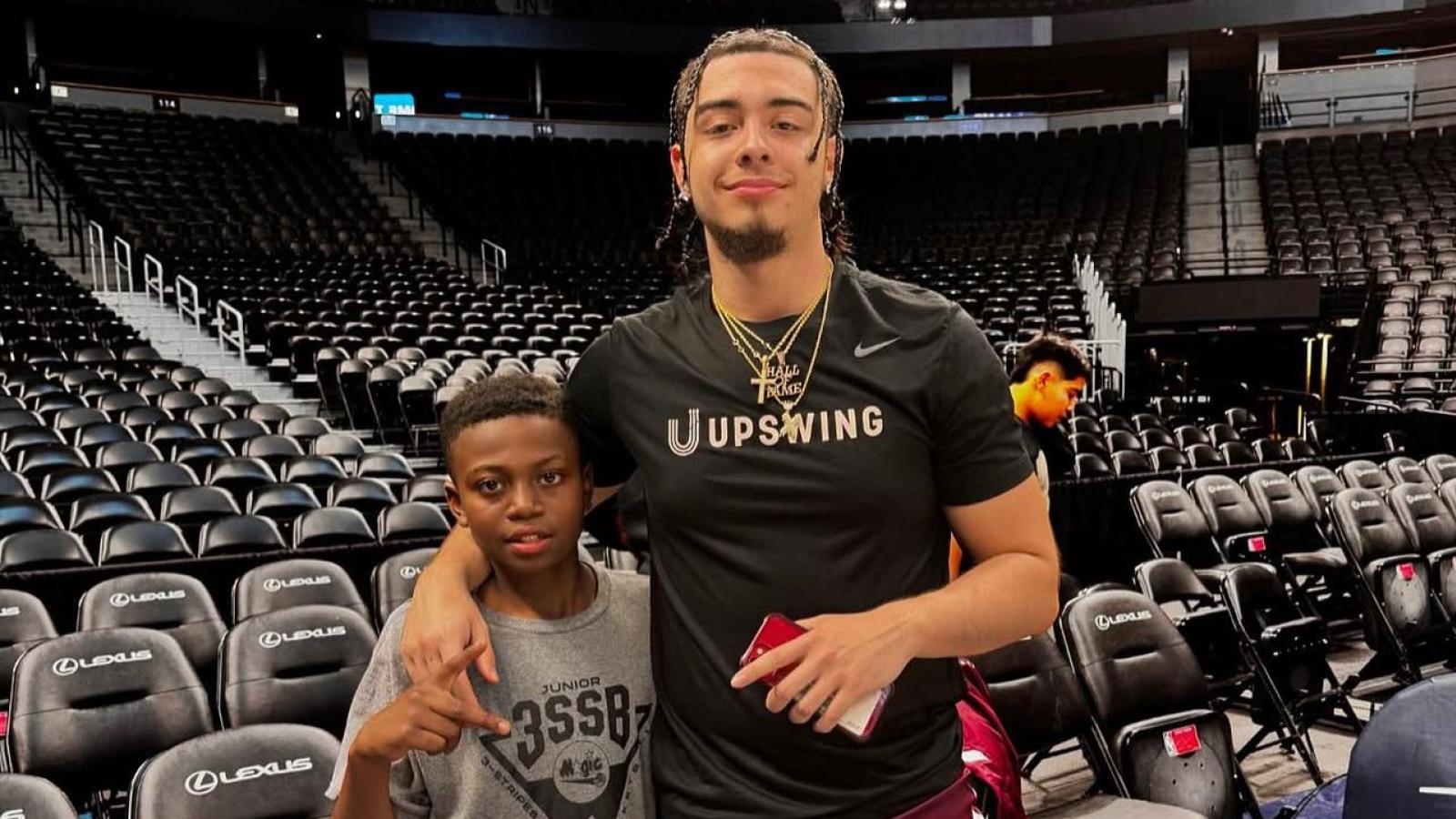 Xaviel Rodriguez with a young HOOPS for HOPE camper