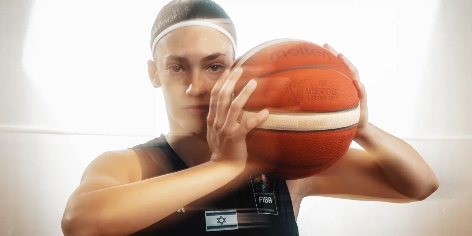 Gal Raviv with basketball in hand