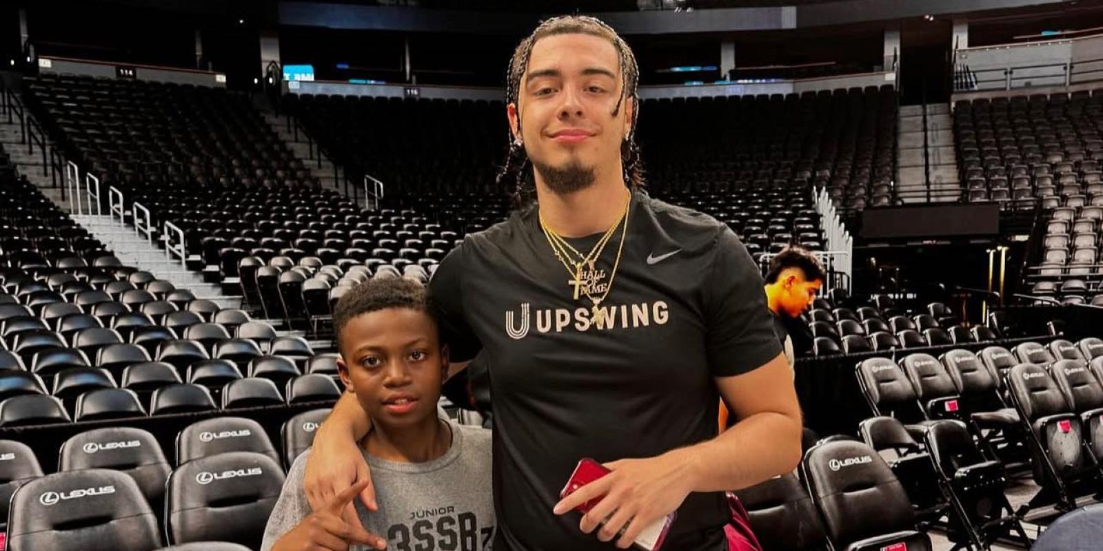 Xaviel Rodriguez with a young HOOPS for HOPE camper