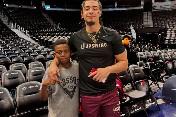 Xaviel Rodriguez with a young HOOPS for HOPE camper