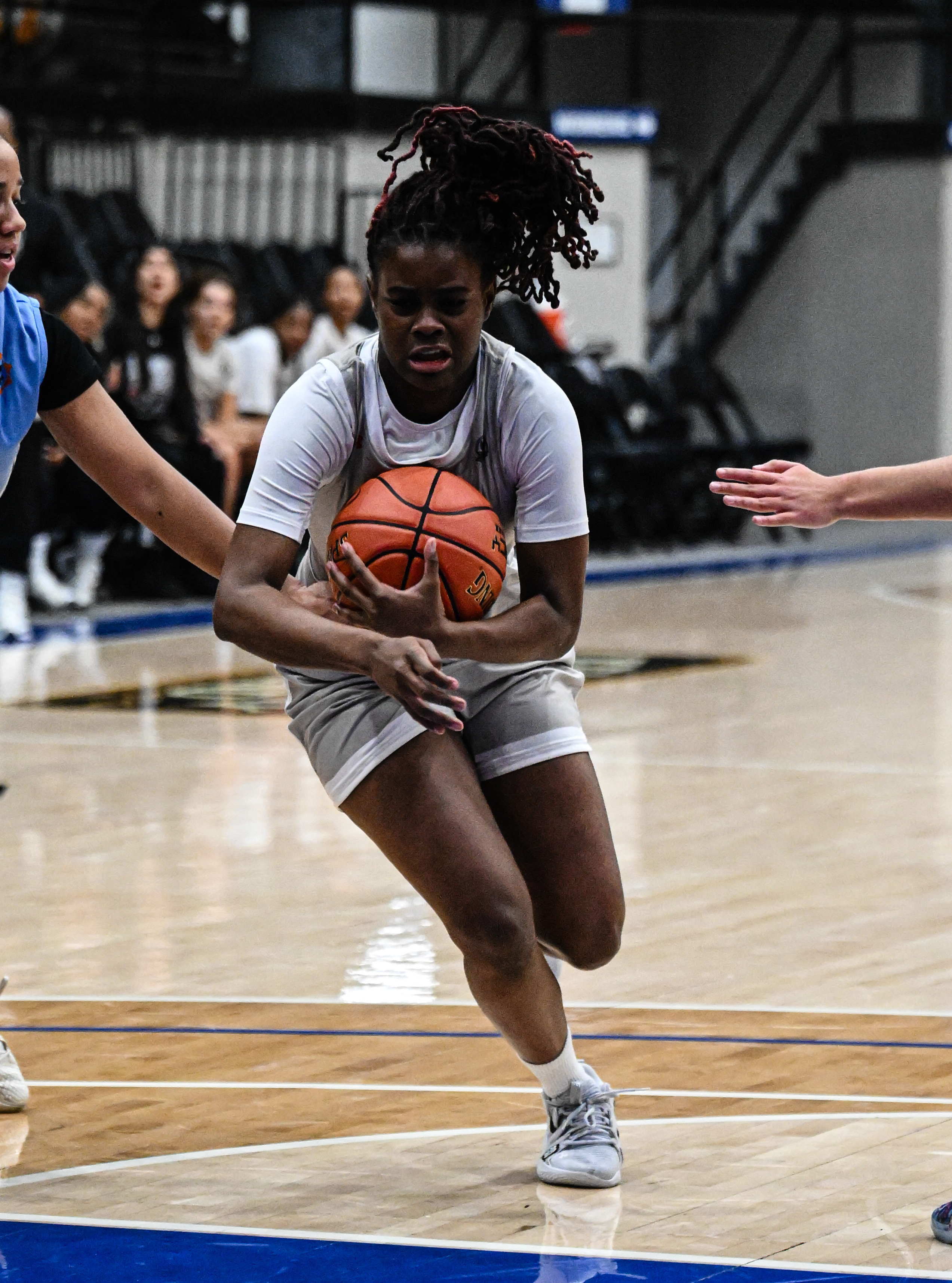 Malika Jenkins protects the ball on the drive