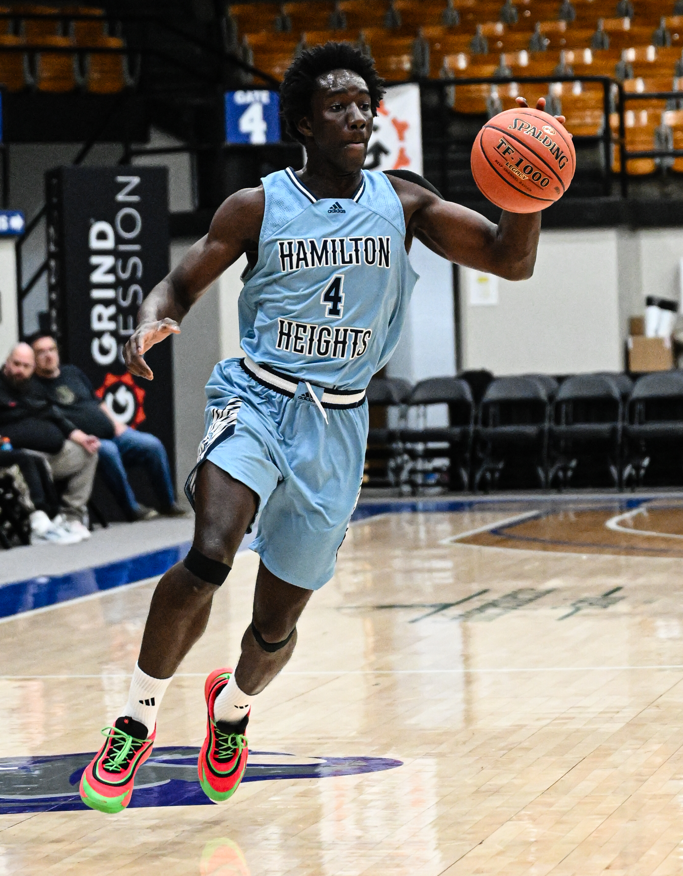 Cheick Coulibaly brings the ball up court for Hamilton Heights