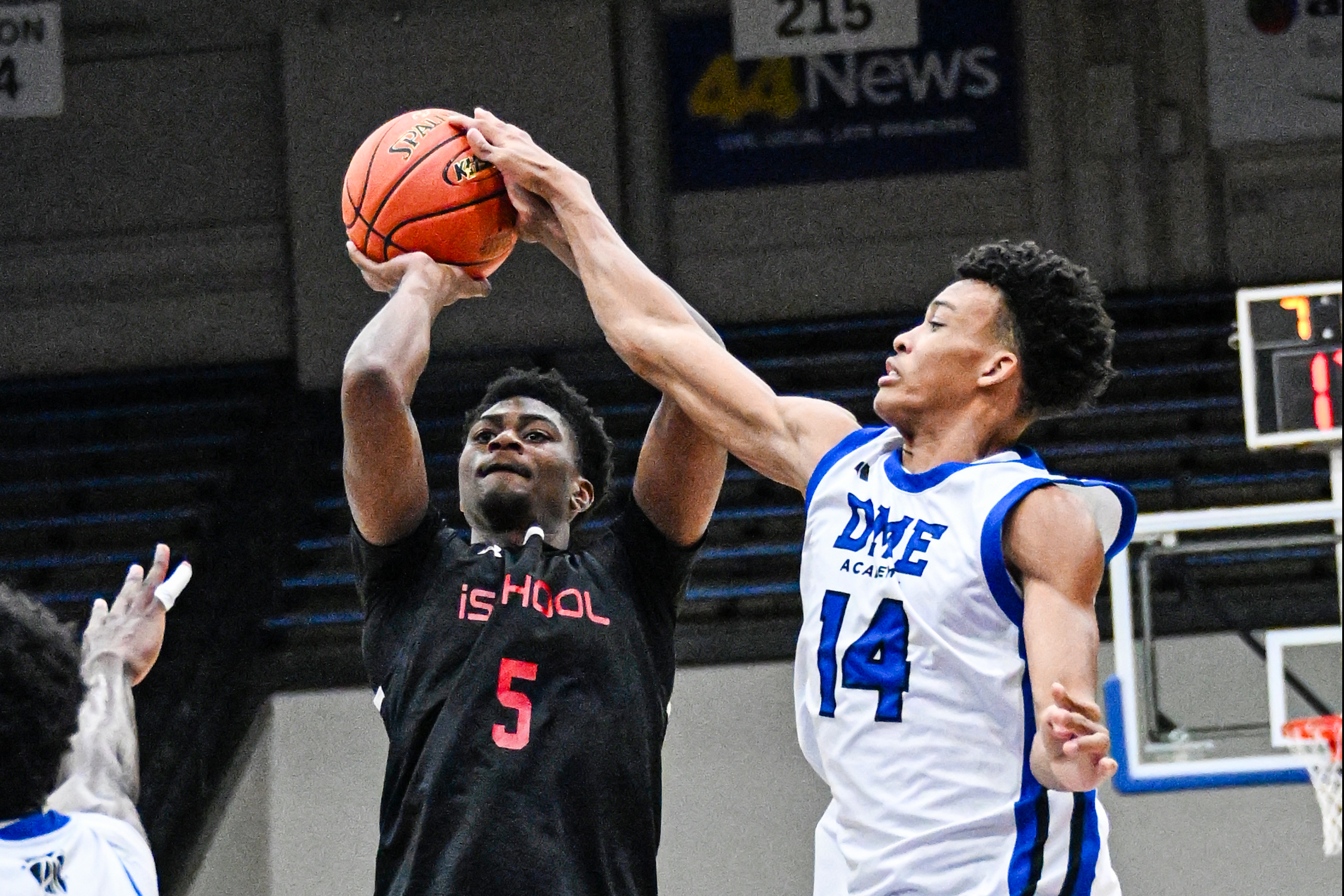 DME's Ryan Hampton with the blocked shot on iSchool's Mario Wooden Jr.