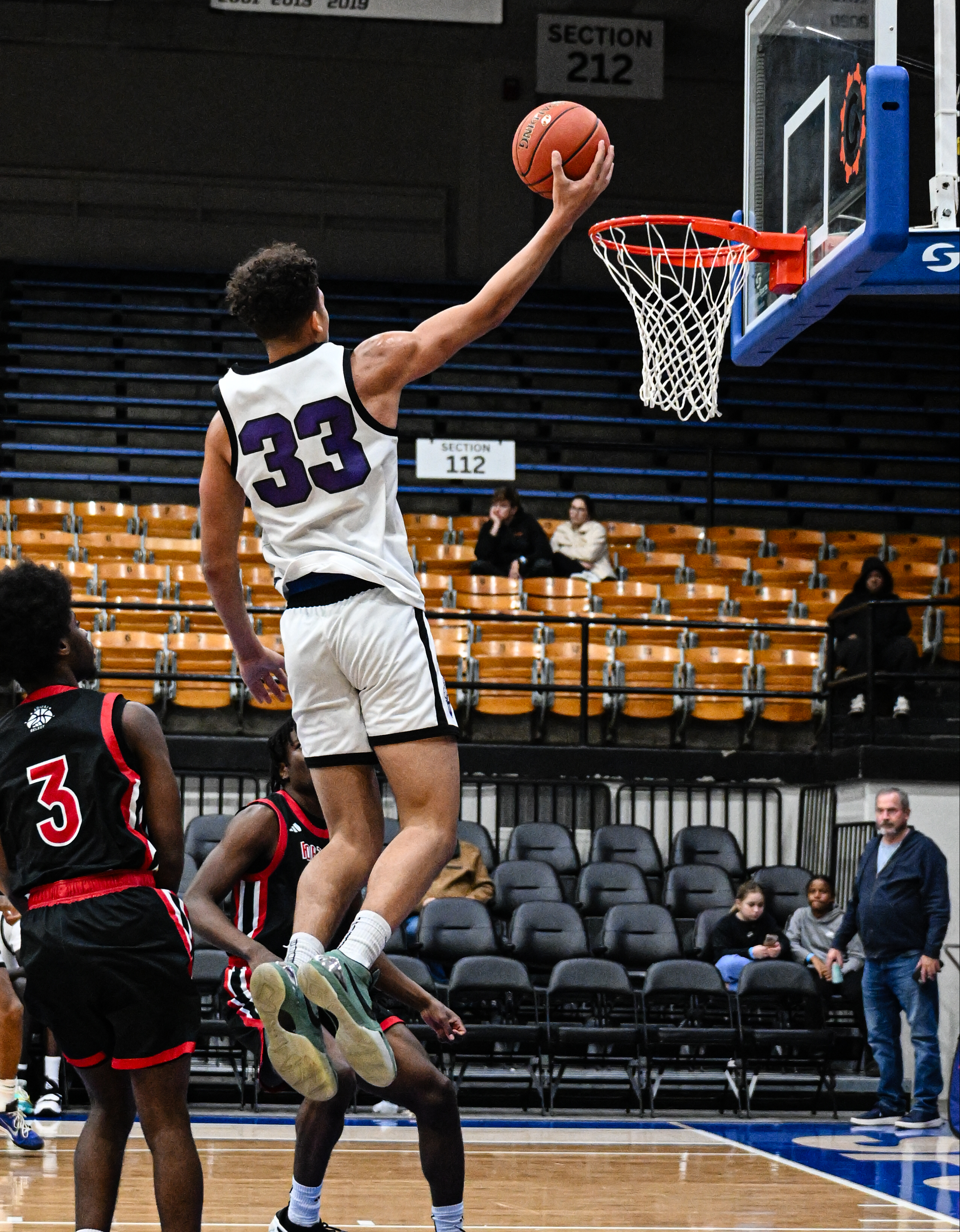Elton James with the one hand finish of the fast break