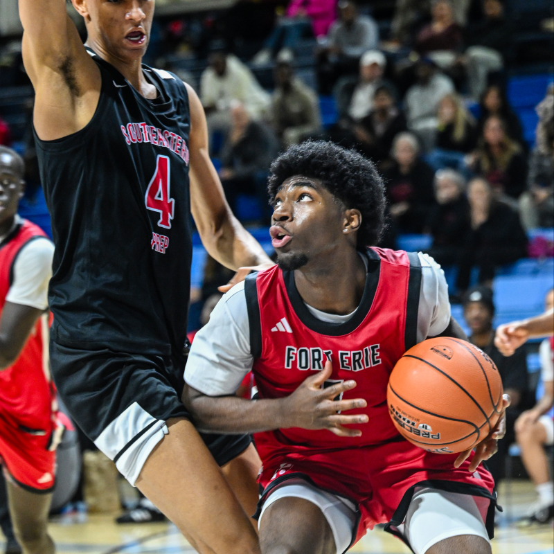 Promis N'Landu drives down low against CJ Rosser Jr