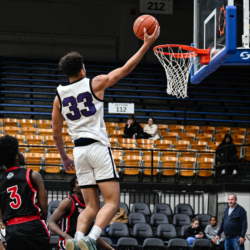 Elton James with the one hand finish of the fast break